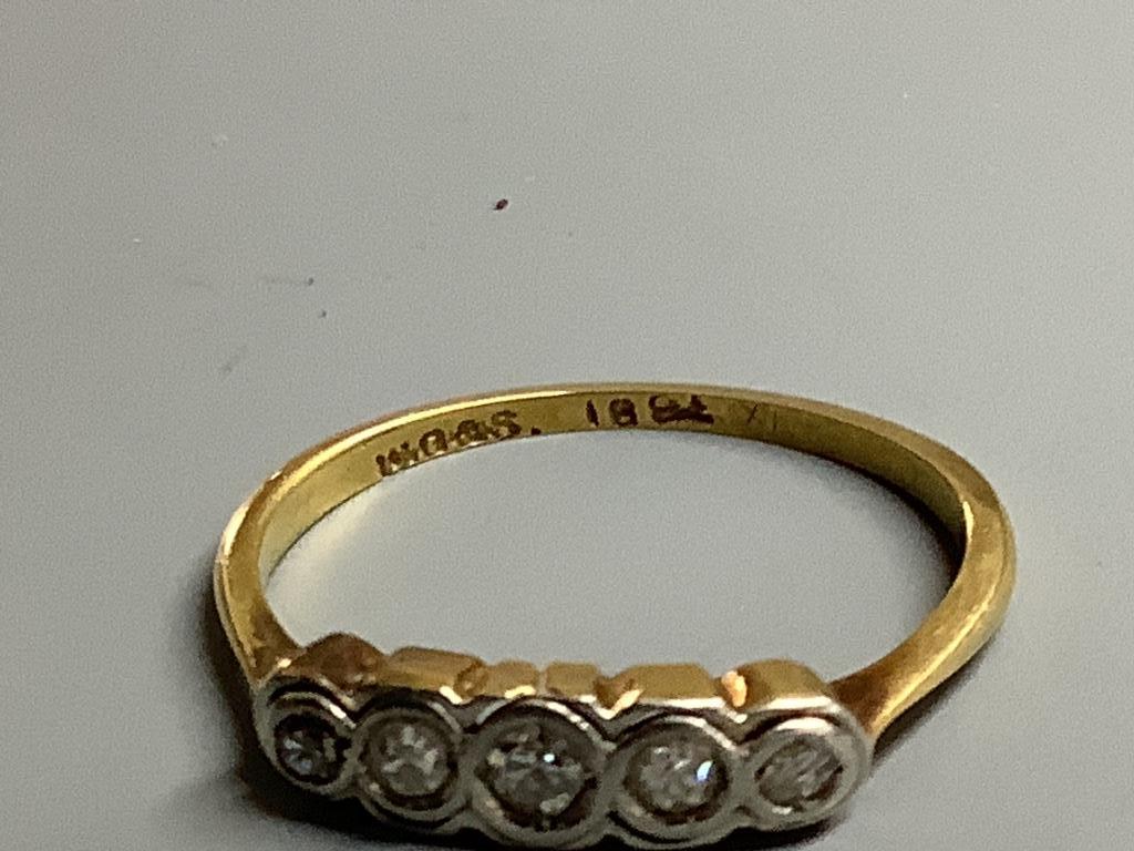 An 18ct and graduated five stone diamond ring, size M, gross 1.5 grams